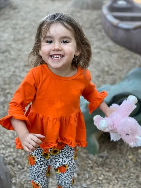 Lil Girl Playing In Red Dress